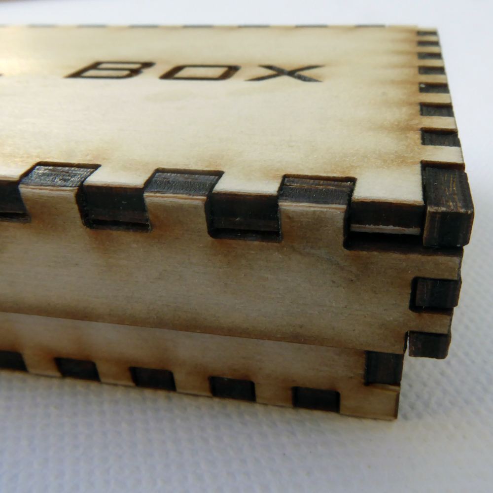 Wooden pencil box with lid