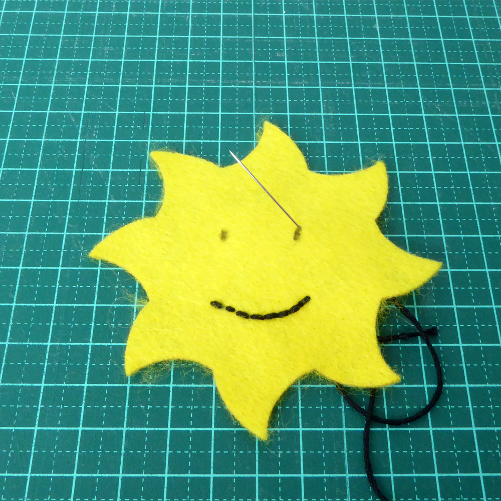 Felt Sun face embroidery